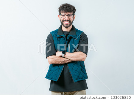 Portrait of cool and handsome casual man with glasses and crossed arms. Smiling and handsome guy with glasses holding arms crossed isolated Portrait of cool and handsome casual man with glasses and crossed arms. Smiling and handsome guy with glasses holding arms crossed isolated 133026830