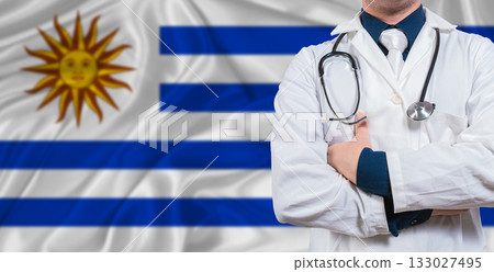 Male doctor with stethoscope on Uruguay flag. Doctor holding stethoscope on Uruguay flag Male doctor with stethoscope on Uruguay flag. Doctor holding stethoscope on Uruguay flag 133027495