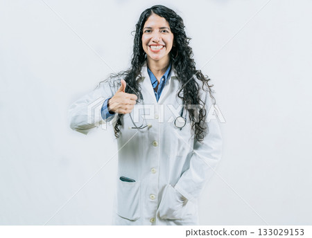 Smiling doctor approving something isolated. Female doctor gesturing OK isolated Smiling doctor approving something isolated. Female doctor gesturing OK isolated 133029153