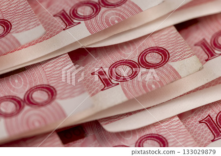 number 100 on Chinese yuan folded together, Chinese money folded together, a large amount of money is the Chinese national currency number 100 on Chinese yuan folded together, Chinese money folded together, a large amount of money is the Chinese national currency 133029879