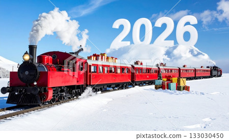 Old steam locomotive on the railway track in the snow at the station 133030450