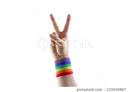 Victory hand with colorful rainbow LGBT wristband isolated on white background with clipping path 133030967