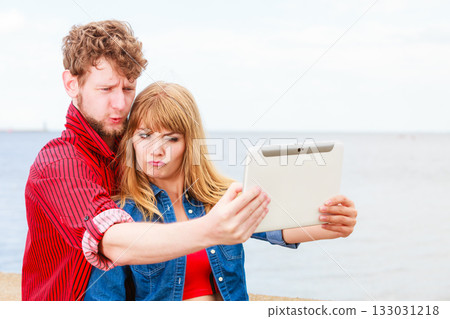 Young couple taking self picture selfie with tablet 133031218