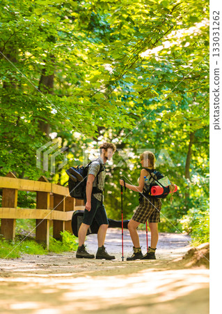 couple backpacker hiking in forest pathway couple backpacker hiking in forest pathway 133031262