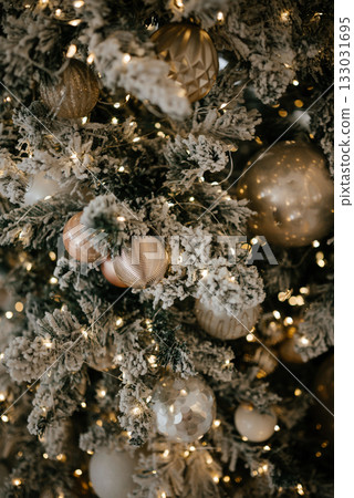 Elegant Christmas Tree with Ornaments and Snowy Branches Elegant Christmas Tree with Ornaments and Snowy Branches 133031695