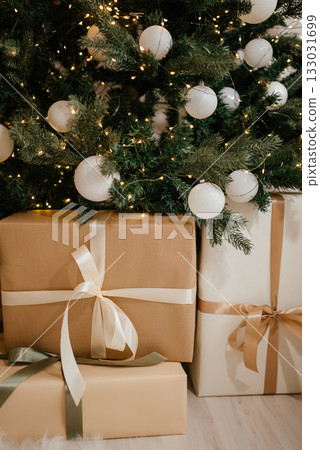 Christmas Gifts under a Decorated Tree with Lights Christmas Gifts under a Decorated Tree with Lights 133031699