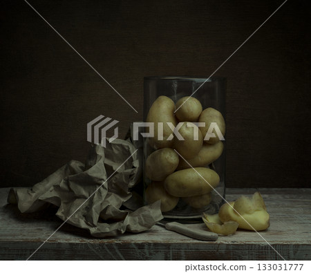 still life. organic raw potatoes peeled on the table still life. organic raw potatoes peeled on the table 133031777