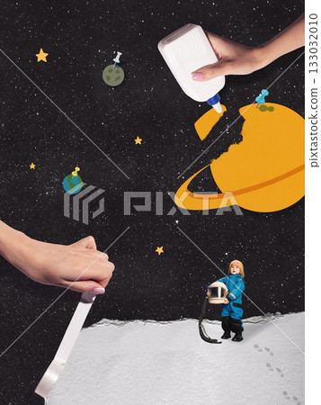 Child astronaut exploring handmade planets in creative space composition 133032010