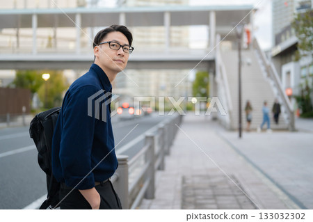 A man walking in the city A man walking in the city 133032302