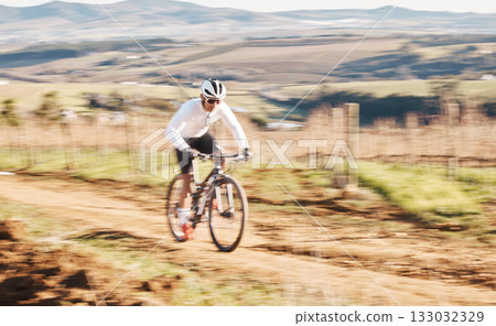 Man, bicycle and cycling with motion blur in nature, countryside and training for triathlon, sports and power. Cyclist, mountain bike and speed for off road travel, exercise or professional challenge Man, bicycle and cycling with motion blur in nature, countryside and training for triathlon, sports and power. Cyclist, mountain bike and speed for off road travel, exercise or professional challenge 133032329
