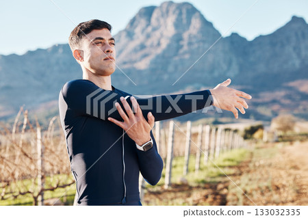 Man, stretching arms with run and fitness outdoor, nature view with hiking or running in countryside, exercise and warm up. Serious, muscle and strong male runner, start with marathon or trekking Man, stretching arms with run and fitness outdoor, nature view with hiking or running in countryside, exercise and warm up. Serious, muscle and strong male runner, start with marathon or trekking 133032335