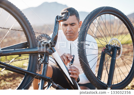 Repair, tools and check with man and mountain bike for fitness, training or exercise in nature. Cycling, sports and adventure with cyclist fixing bicycle on trail for gears, maintenance or inspection Repair, tools and check with man and mountain bike for fitness, training or exercise in nature. Cycling, sports and adventure with cyclist fixing bicycle on trail for gears, maintenance or inspection 133032356