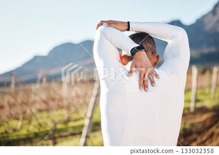 Man, stretching before running and fitness outdoor with hiking or run in countryside, exercise and warm up. Arms, muscle and strong male with back view, start with race for marathon or trekking 133032358