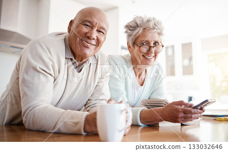 Portrait, senior and old interracial couple relax in home kitchen in the morning with coffee happy, smile and confident together. Old man and elderly woman on counter enjoying retirement in happiness 133032646