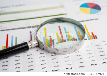 Magnifying glass on graph paper. Financial development, Banking Account, Statistics, Investment Analytic research data economy, Business. Magnifying glass on graph paper. Financial development, Banking Account, Statistics, Investment Analytic research data economy, Business. 133032921