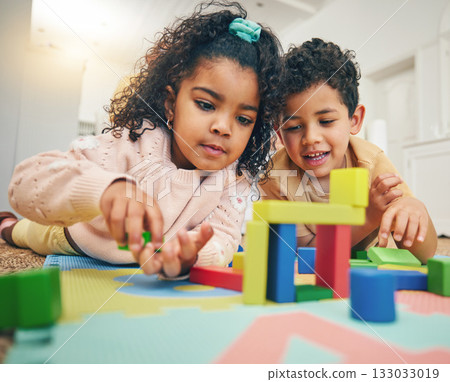 Building blocks, happy children and floor with toys for playing, bonding and educational games at home. Family, child development and boy and girl enjoy creative activity, learning and relaxing Building blocks, happy children and floor with toys for playing, bonding and educational games at home. Family, child development and boy and girl enjoy creative activity, learning and relaxing 133033019