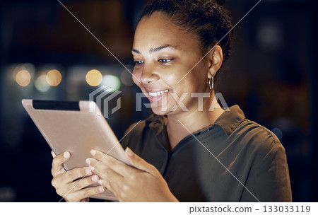 Tablet, night and business woman reading online data analysis, feedback report or customer experience insight. Brand monitoring software, social media research and African worker review web analytics 133033119