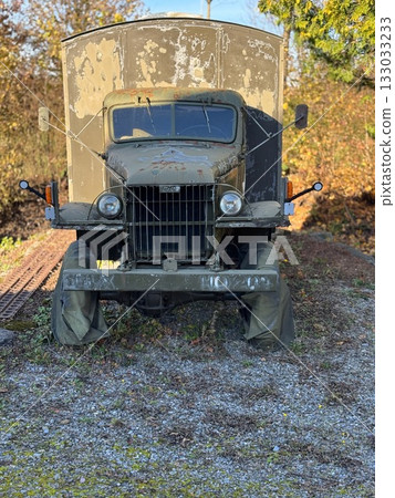 Rustic Military Truck on Gravel Next to Tracks 133033233