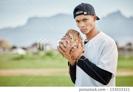 Portrait pitcher, baseball player or man training for a sports game on outdoor field stadium. Fitness, motivation or focused athlete pitching or throwing a ball with a glove in workout or exercise Portrait pitcher, baseball player or man training for a sports game on outdoor field stadium. Fitness, motivation or focused athlete pitching or throwing a ball with a glove in workout or exercise 133033321