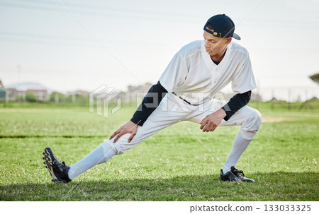 Baseball stadium, stretching or sports athlete on field ready for training match on grass in summer. Active man, fitness workout or young player in legs warm up to start softball exercise outdoors Baseball stadium, stretching or sports athlete on field ready for training match on grass in summer. Active man, fitness workout or young player in legs warm up to start softball exercise outdoors 133033325