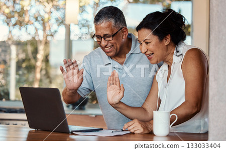Laptop, wave and senior couple on video call in home, laughing and talking to contact. Technology, computer and happy, elderly and retired man and woman waving in virtual or online chat for greeting. 133033404
