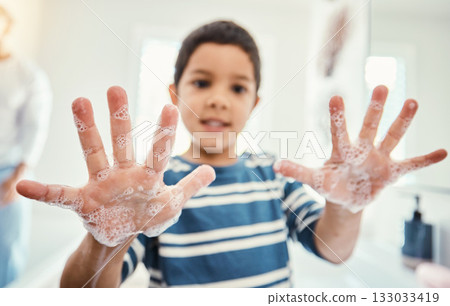 Cleaning, hands with soap and boy in bathroom for hygiene, wellness and healthcare at home. Healthy family, skincare and portrait of child with open palms washing with water, soap and disinfection 133033419