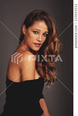 Beauty, makeup and face portrait of a woman in studio for hair care, fashion and cosmetics. Aesthetic female model person with skin glow, salon shine results and elegant style on a grey background Beauty, makeup and face portrait of a woman in studio for hair care, fashion and cosmetics. Aesthetic female model person with skin glow, salon shine results and elegant style on a grey background 133033552
