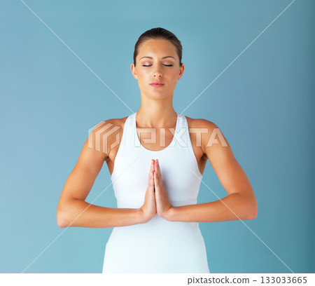 Woman, meditation and yoga with prayer pose, spiritual and healing with fitness isolated on blue background. Peace, zen and mindfulness, female yogi meditate in studio with mockup space and calm 133033665