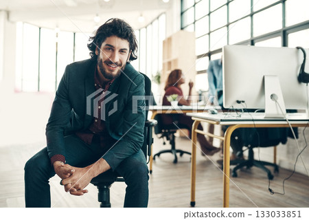 Portrait, confidence and happy man in chair at coworking space, ideas for project and entrepreneur at design agency. Leader in creativity, idea and happiness, businessman with creative plan in office 133033851