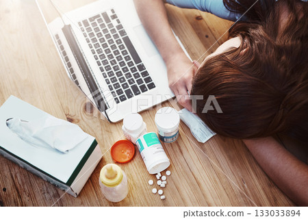 Sleeping, sick and woman with laptop and pills, flu and burnout in the workplace, medicine and tired. Female person, employee and illness with technology, medication and sleeping with telehealth 133033894