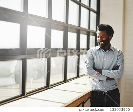 Window, flare and a business man arms crossed in the office with a smile or mindset of future success. Happy, vision and corporate with a male employee standing in the workplace during his break 133033900