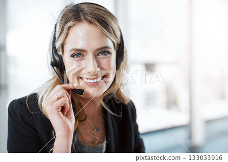 Woman with headset, callcenter and smile in portrait, phone call with communication and CRM with mockup space. Customer service, telemarketing and female consultant on help desk and contact us 133033916