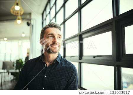 Thinking, ideas and face of man at office window, creative startup and business project for entrepreneur at design agency. Boss with creativity, job idea and focus, businessman with plan in workplace 133033917