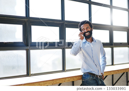 Window, phone call and thinking with a business man in the office for communication or networking. Happy, vision and idea with a happy male employee chatting in the workplace during his break 133033991