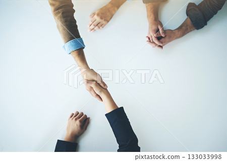 Handshake, agreement and business people in partnership, support and trust together for business consulting. Above, collaboration and team in negotiation, welcome or deal with witness at table Handshake, agreement and business people in partnership, support and trust together for business consulting. Above, collaboration and team in negotiation, welcome or deal with witness at table 133033998