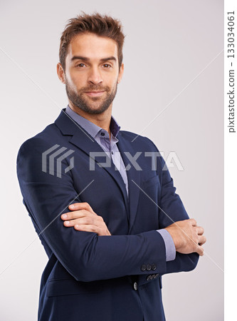 Portrait of business man, arms crossed with confidence in a suit isolated on studio background. Professional mindset, career success and businessman with corporate male employee and leadership Portrait of business man, arms crossed with confidence in a suit isolated on studio background. Professional mindset, career success and businessman with corporate male employee and leadership 133034061