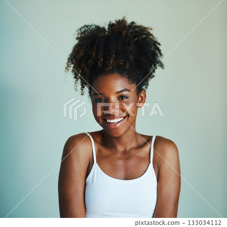 Happiness, youth and portrait of black woman on studio background with afro, smile and skincare. Beauty, dermatology and happy African girl, model with mockup, natural cosmetics and beautiful face. Happiness, youth and portrait of black woman on studio background with afro, smile and skincare. Beauty, dermatology and happy African girl, model with mockup, natural cosmetics and beautiful face. 133034112
