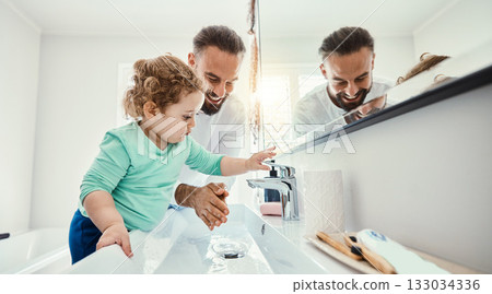 Cleaning, washing hands and father with baby in bathroom for hygiene, wellness and healthcare at home. Family, skincare and dad with child learning to wash with water, soap and disinfection by faucet Cleaning, washing hands and father with baby in bathroom for hygiene, wellness and healthcare at home. Family, skincare and dad with child learning to wash with water, soap and disinfection by faucet 133034336