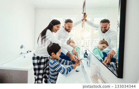 Family, washing hands and bathroom with a mom, father and children with hygiene care in morning. Mother, kids and dad together with love, support and youth in a home doing self care at a sink 133034344
