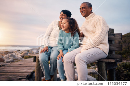 Happy, beach and girl on holiday with her grandparents sightseeing, bonding and having fun together. Travel, love and elderly couple in retirement on a seaside vacation with a girl child in Mexico. 133034377