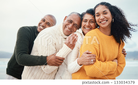 Portrait, happy family and hug at the beach by siblings with mature parents on holiday, happy and bonding. Face, love and senior couple happy on retirement vacation while embracing adult children Portrait, happy family and hug at the beach by siblings with mature parents on holiday, happy and bonding. Face, love and senior couple happy on retirement vacation while embracing adult children 133034379