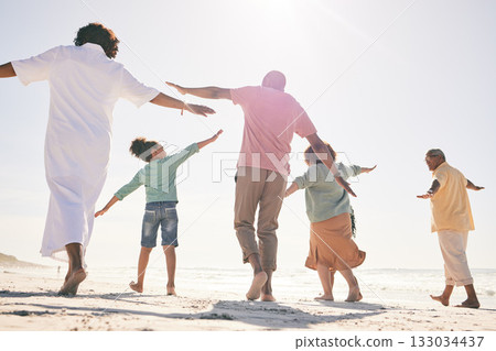 Family on beach, freedom and generations on vacation with fun and grandparents, parents and kids. Travel, people outdoor and carefree, excited running and playful, happiness on adventure back view 133034437