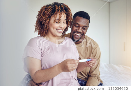 Couple with pregnancy test results, fertility and people having a baby, happy with love and care at home. Interracial, black man and pregnant woman, start family with new mother and father with smile Couple with pregnancy test results, fertility and people having a baby, happy with love and care at home. Interracial, black man and pregnant woman, start family with new mother and father with smile 133034630