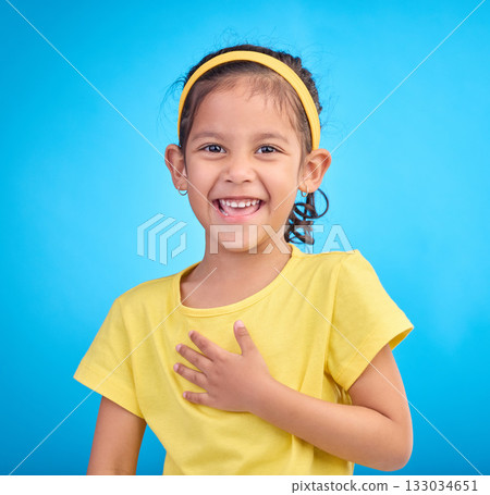 Child laugh, happy portrait and smile of a little girl in a studio with blue background feeling cute. Happiness, adorable and face of a confident, playful and fun kid laughing about a funny joke Child laugh, happy portrait and smile of a little girl in a studio with blue background feeling cute. Happiness, adorable and face of a confident, playful and fun kid laughing about a funny joke 133034651