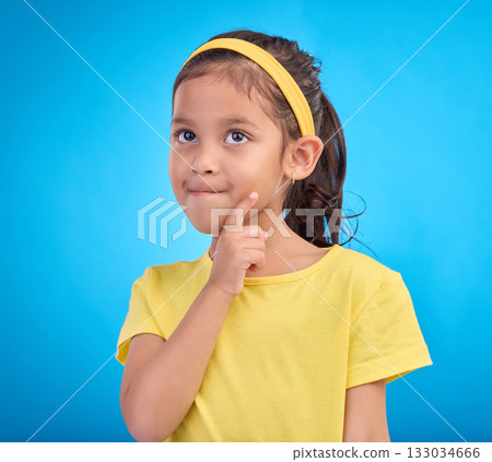 Thinking, idea and face of child in studio with contemplation, thoughtful and planning expression. Ideas mockup, innovation and young girl on blue background for brainstorming, question and curious Thinking, idea and face of child in studio with contemplation, thoughtful and planning expression. Ideas mockup, innovation and young girl on blue background for brainstorming, question and curious 133034666