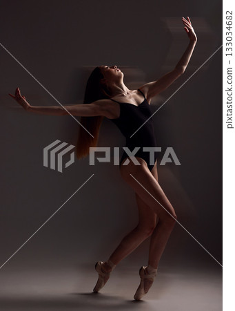 Art, dance and woman in the dark for ballet isolated on a black background in a studio. Creative, elegant and contemporary dancer dancing for a theater performance, rehearsal or ballerina movement Art, dance and woman in the dark for ballet isolated on a black background in a studio. Creative, elegant and contemporary dancer dancing for a theater performance, rehearsal or ballerina movement 133034682