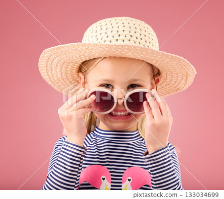 Vacation, portrait of child in studio with sunglasses and fun clothes and hat isolated on pink background. Summer, holiday and fashion, happy girl in Australia excited for travel with smile on face. Vacation, portrait of child in studio with sunglasses and fun clothes and hat isolated on pink background. Summer, holiday and fashion, happy girl in Australia excited for travel with smile on face. 133034699