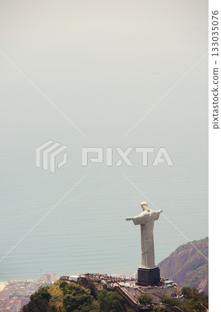 Brazil, monument and Christ the Redeemer by ocean for tourism, sightseeing and travel destination. Landscape, Rio de Janeiro mockup and aerial view of statue, sculpture and landmark on mountain 133035076