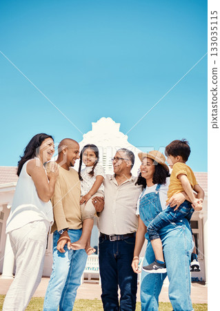 Happy, bonding and big family on the lawn at a house for happiness, visit and hug. Smile, affection and children, parents and grandparents on a garden of a home for playing, conversation and love 133035115