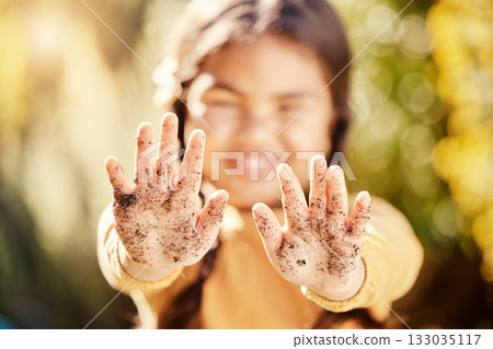 Dirt soil hands, girl child and gardening mockup with blurred background with smile, happiness and outdoor. Kid, garden development and backyard for sustainability, learning and ecology for growth 133035117